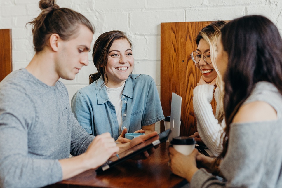 People talking and smiling in a group